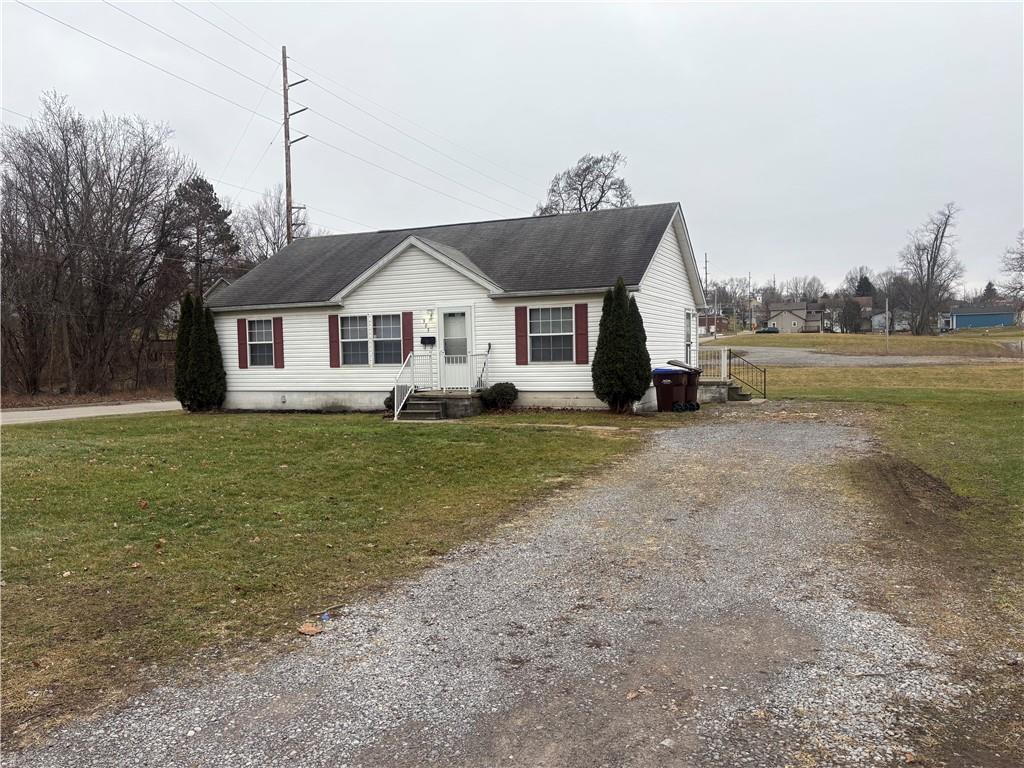 903 Union Street Farrell, PA 16121 - Photo 1 of 29 a view of a house next to a big yard with large trees