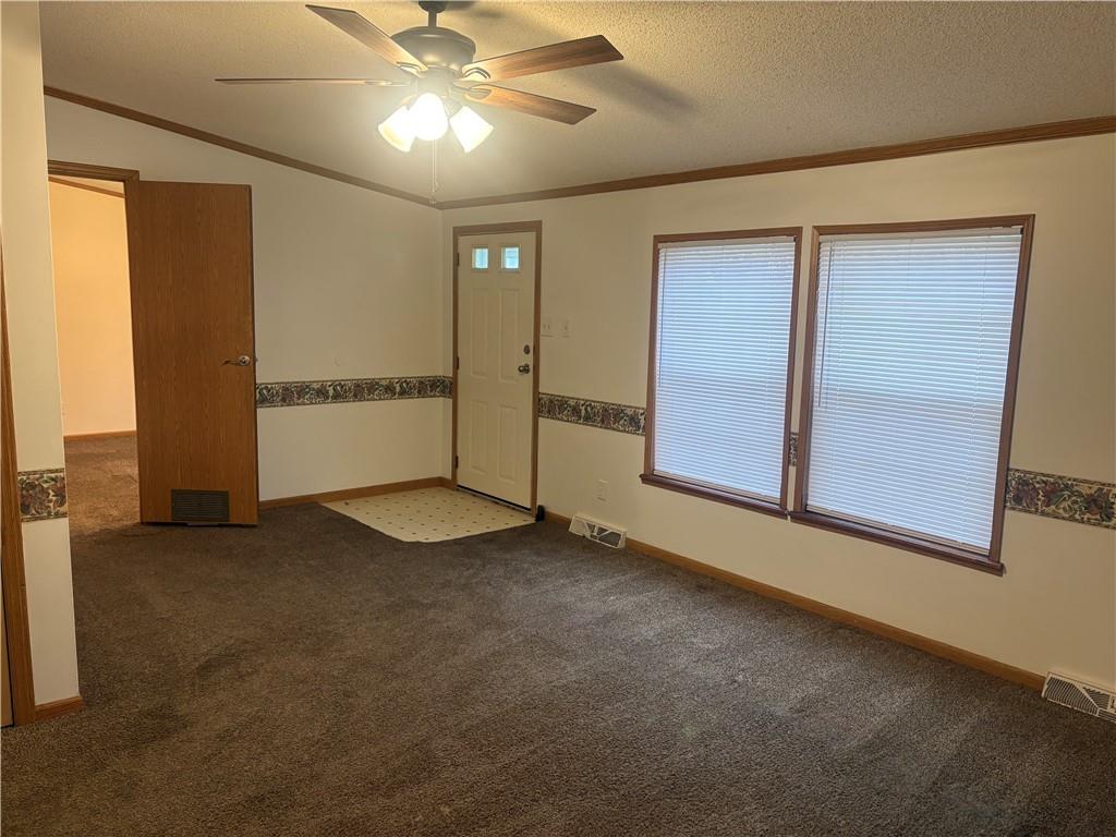 903 Union Street Farrell, PA 16121 - Photo 3 of 29 an empty room with windows and ceiling fan
