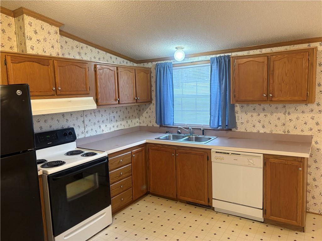 903 Union Street Farrell, PA 16121 - Photo 7 of 29 a kitchen with stainless steel appliances a stove a sink and a microwave