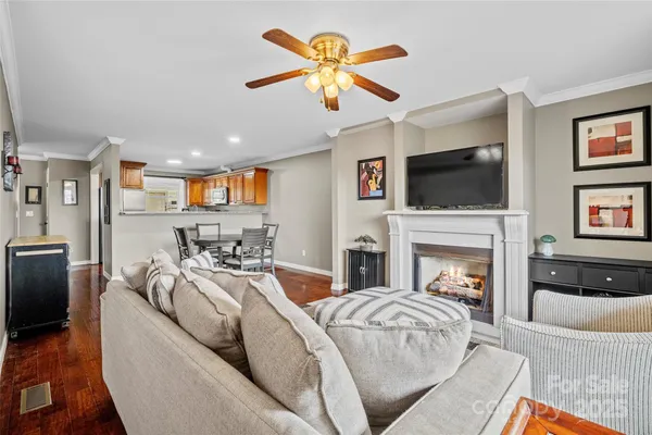 a bed room with a bed a fireplace and a television