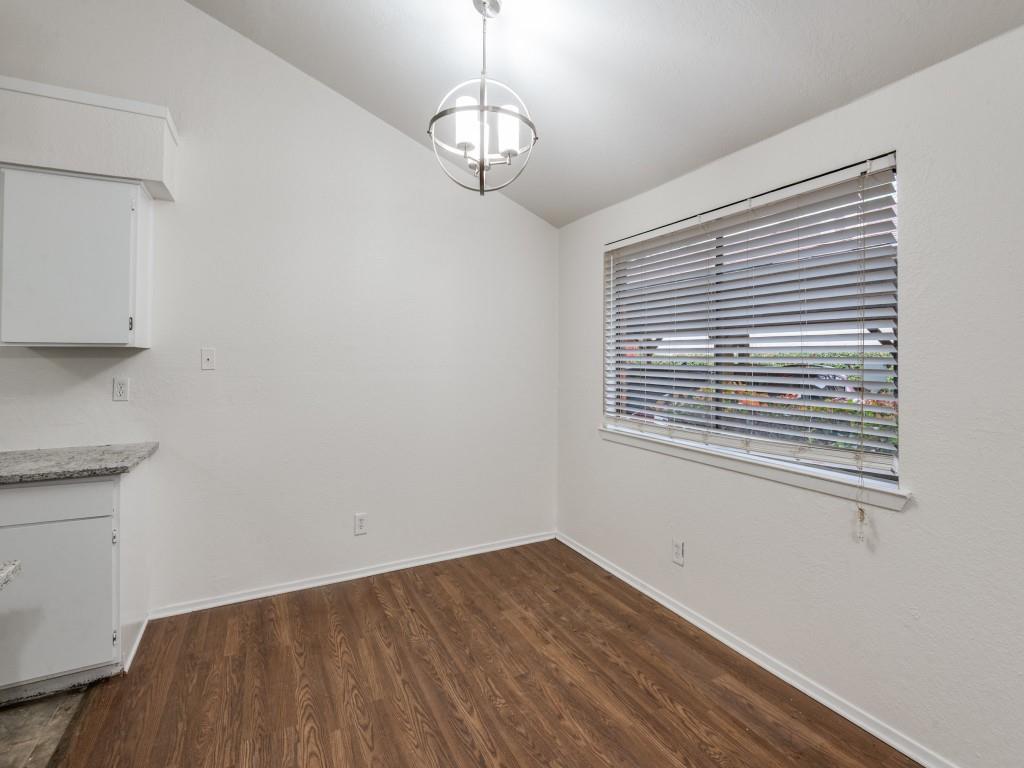 2240 Tarpley Road, Unit 462 Carrollton, TX 75006 - Photo 6 of 12 a view of a room with wooden floor and windows