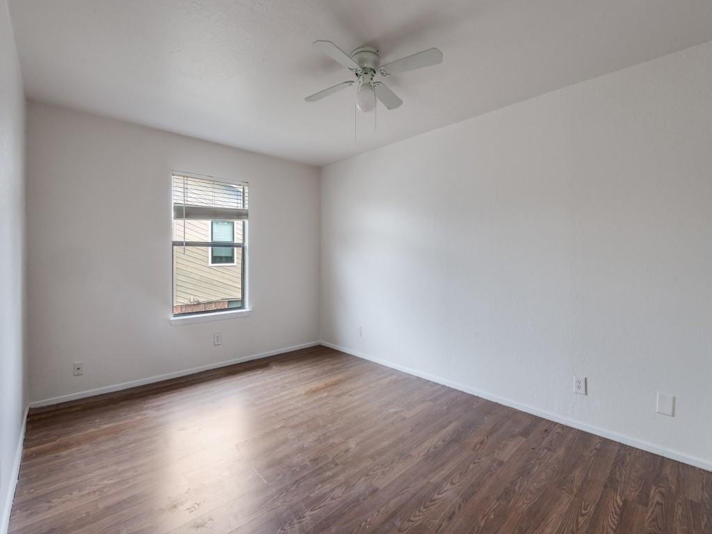 2240 Tarpley Road, Unit 462 Carrollton, TX 75006 - Photo 10 of 12 an empty room with wooden floor and windows