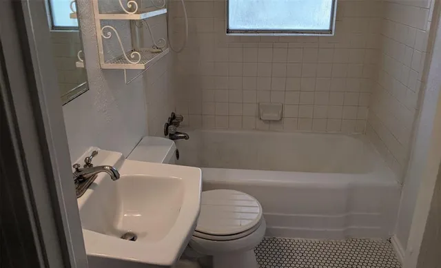 a view of a bathroom from a hallway