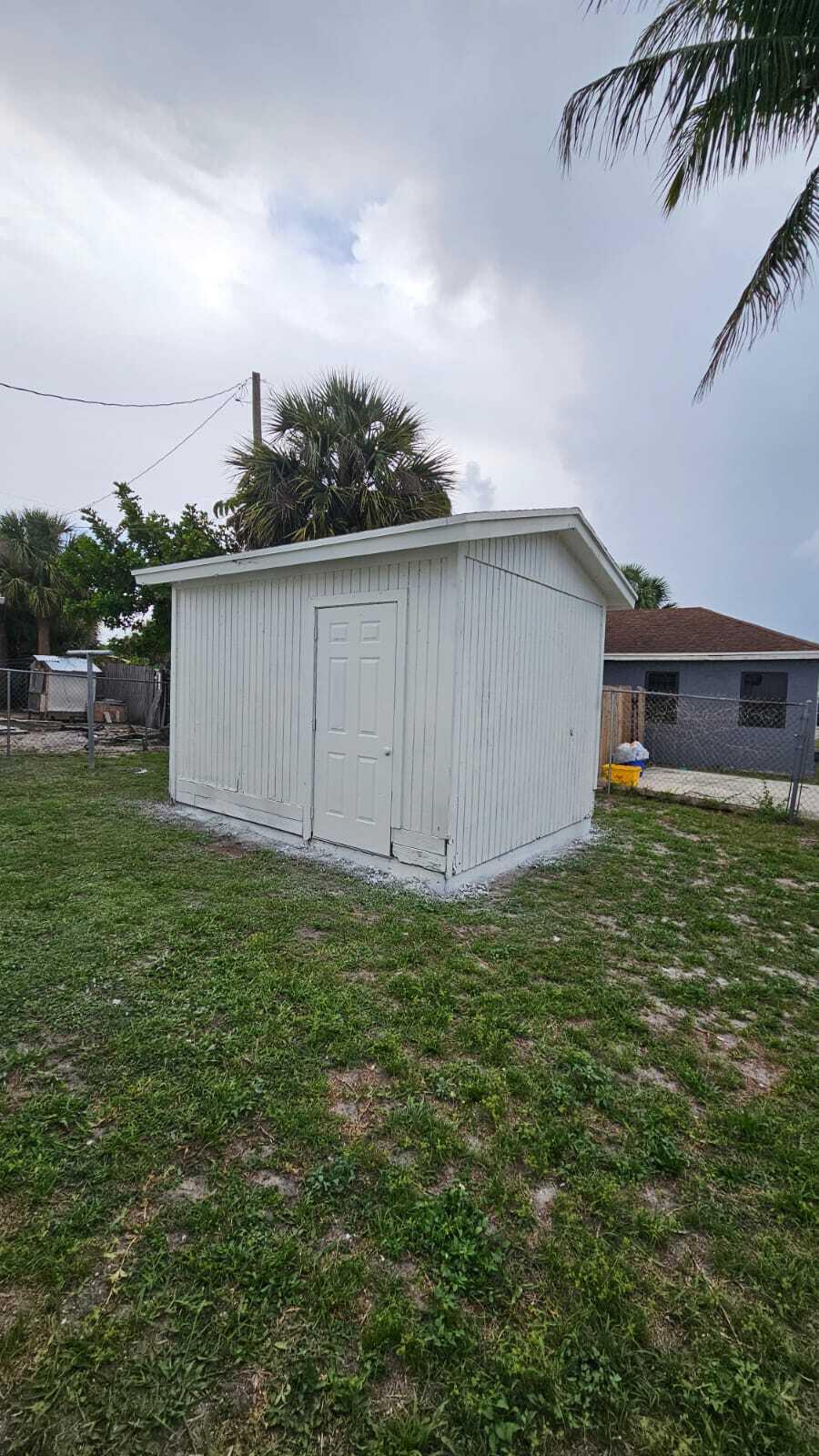 3391 Avenue South Riviera Beach, FL 33404 - Photo 2 of 16 a backyard of a house with lots of green space