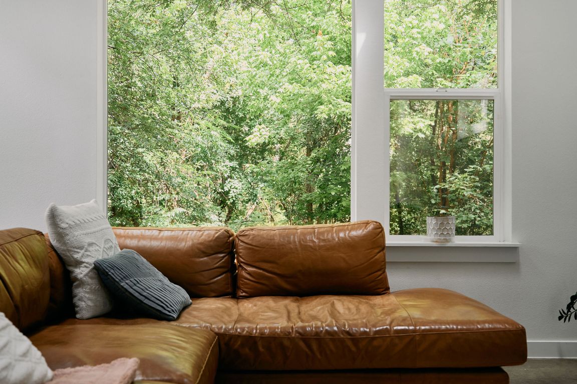 3001 Del Curto Road, Unit 14 Austin, TX 78704 - Photo 4 of 18 a bedroom with a bed and a couch