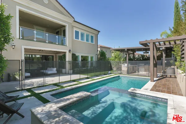 a view of swimming pool with patio