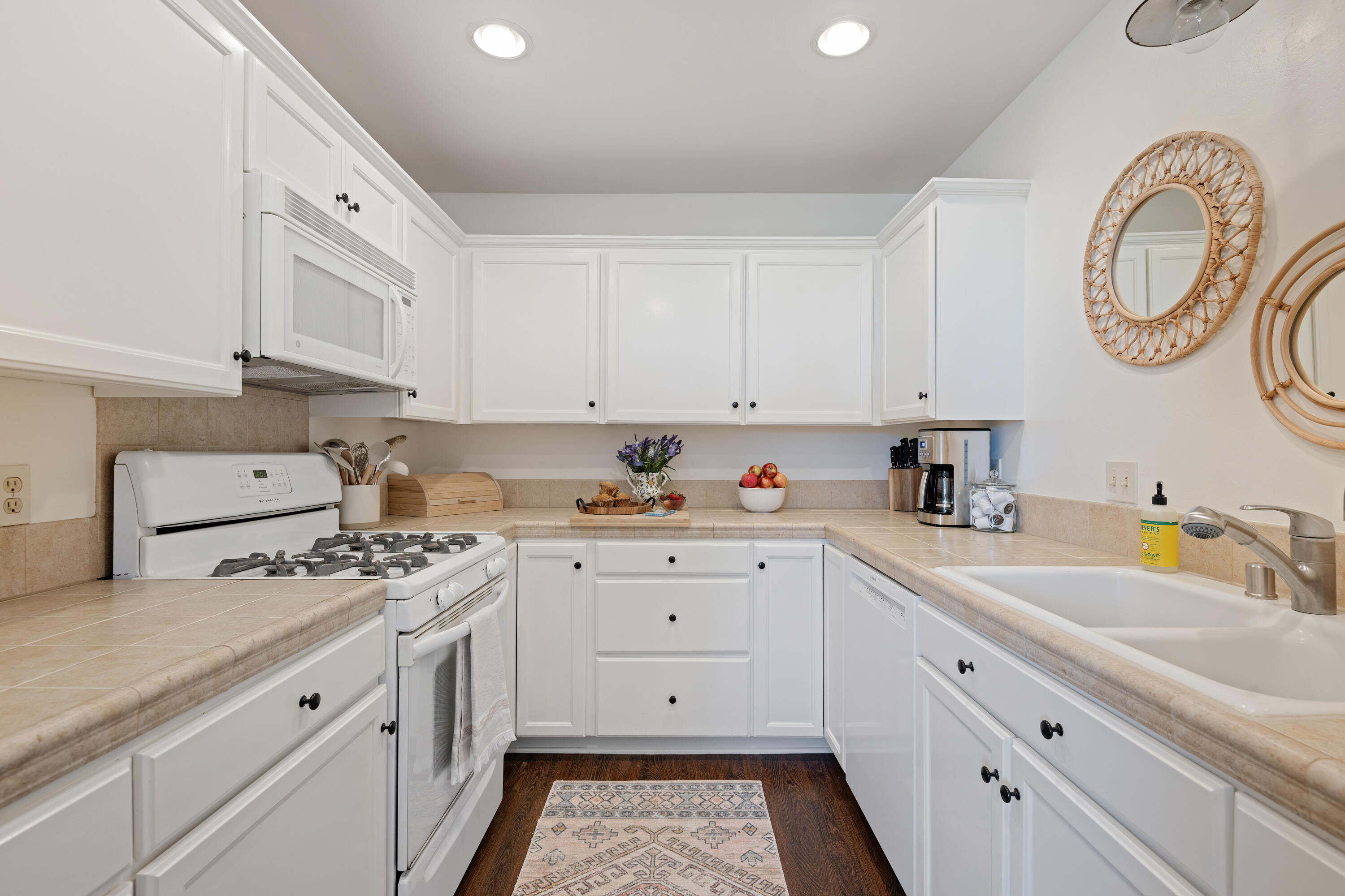 Undisclosed Address Santa Barbara, CA 93111 - Photo 11 of 20 a kitchen with granite countertop white cabinets white stainless steel appliances and a sink