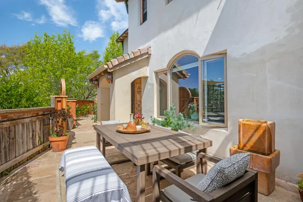 a outdoor space with patio the couches and a dining table with chairs