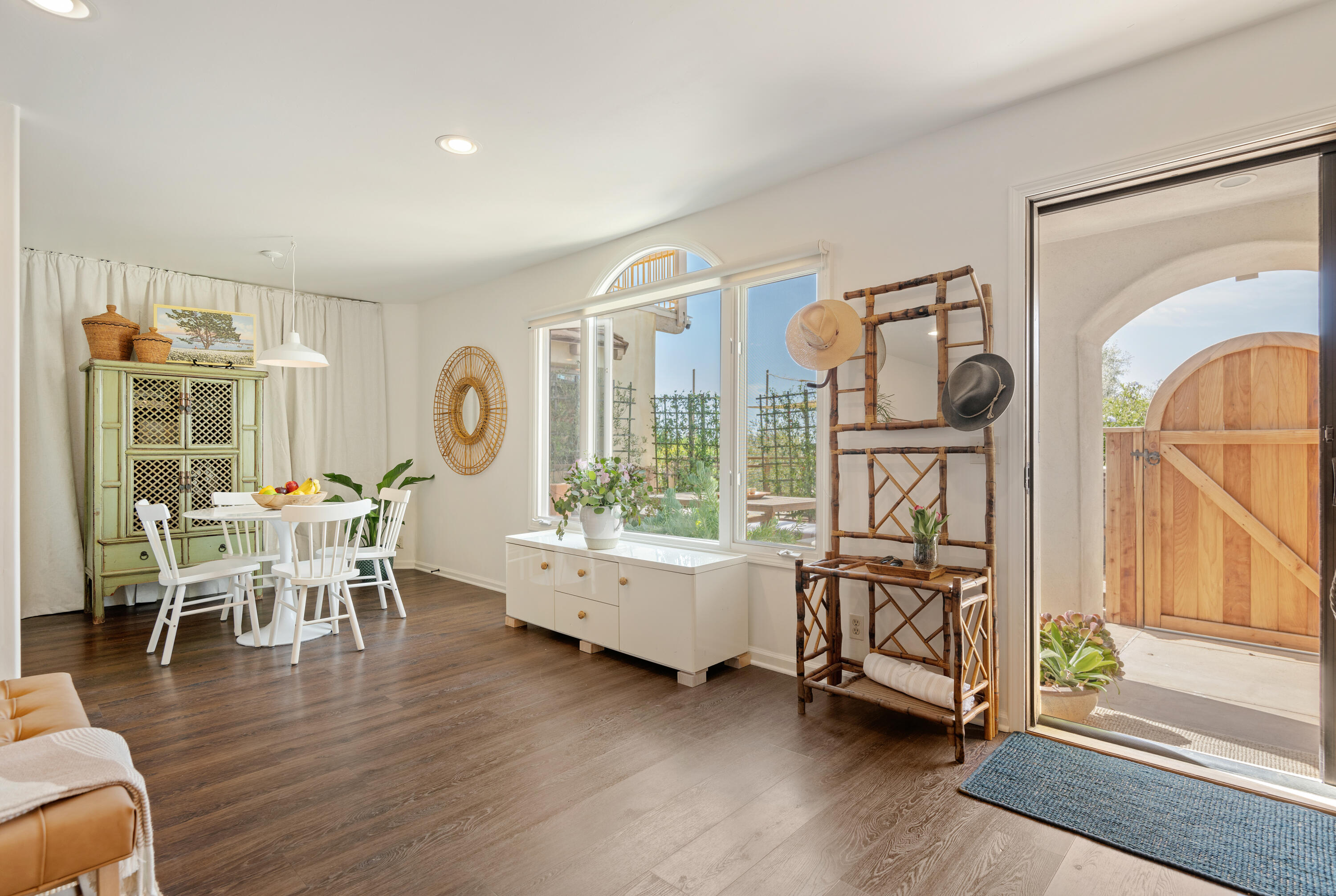 Undisclosed Address Santa Barbara, CA 93111 - Photo 9 of 20 a dining room with wooden floor table and chairs