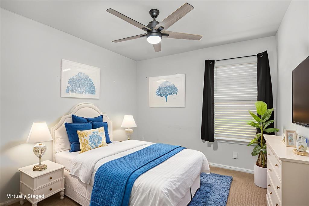 805 Durango Lane Cleburne, TX 76033 - Photo 19 of 23 a bedroom with bed and a chandelier