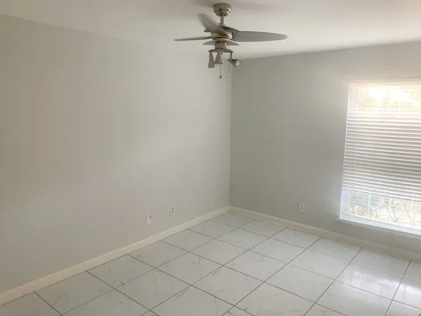 a view of a room that has a window in it