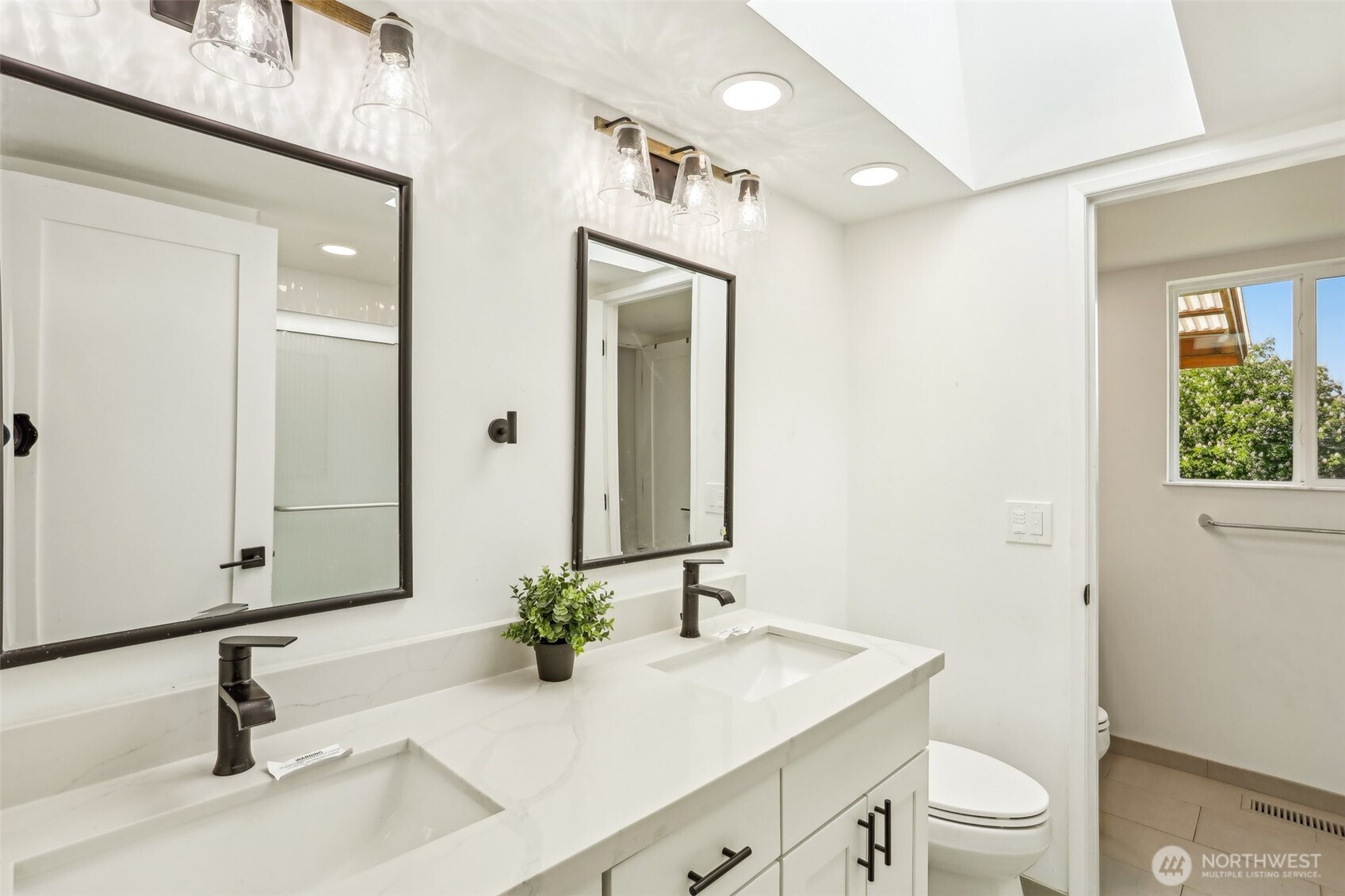 2531 Smithers Avenue South Renton, WA 98055 - Photo 13 of 24 a bathroom with a sink a toilet and a mirror