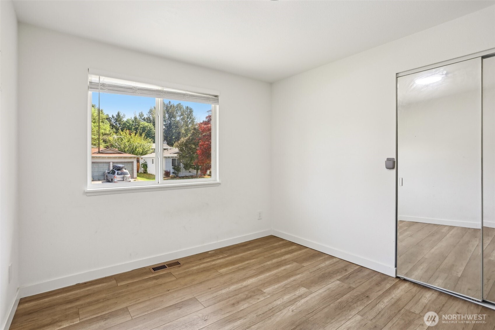 2531 Smithers Avenue South Renton, WA 98055 - Photo 15 of 24 an empty room with wooden floor and a window