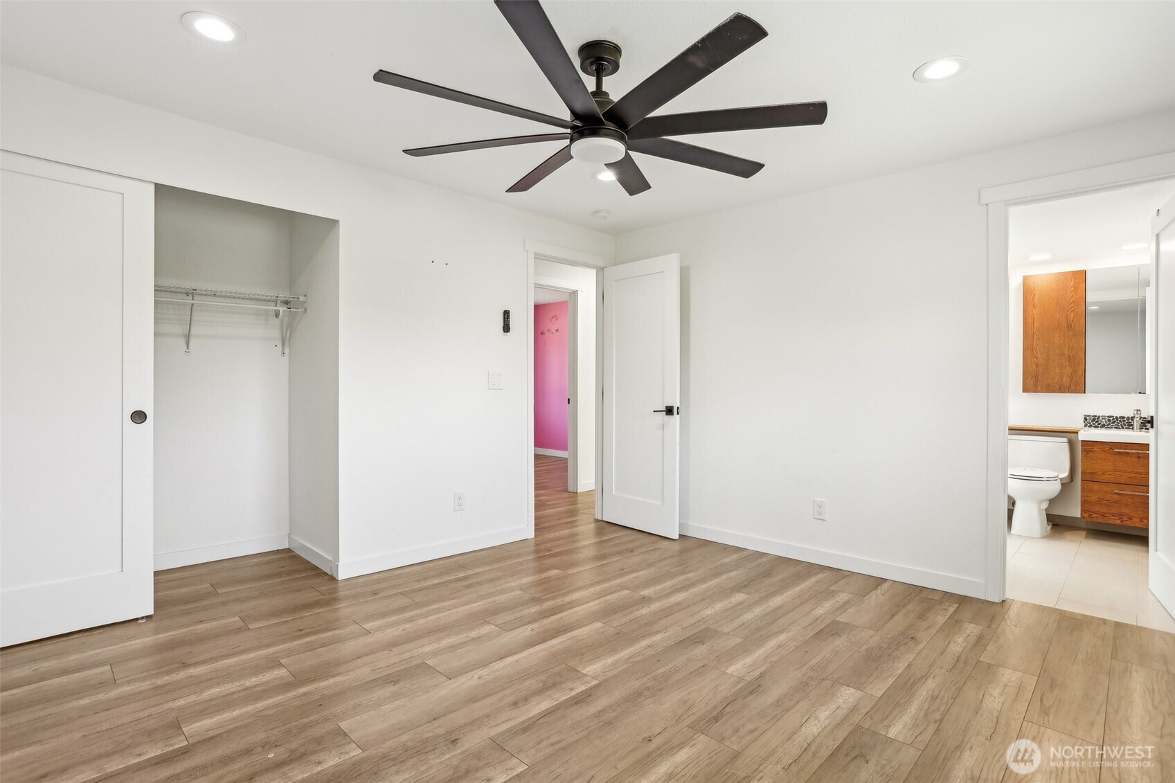 2531 Smithers Avenue South Renton, WA 98055 - Photo 16 of 24 an empty room with wooden floor a ceiling fan and closet