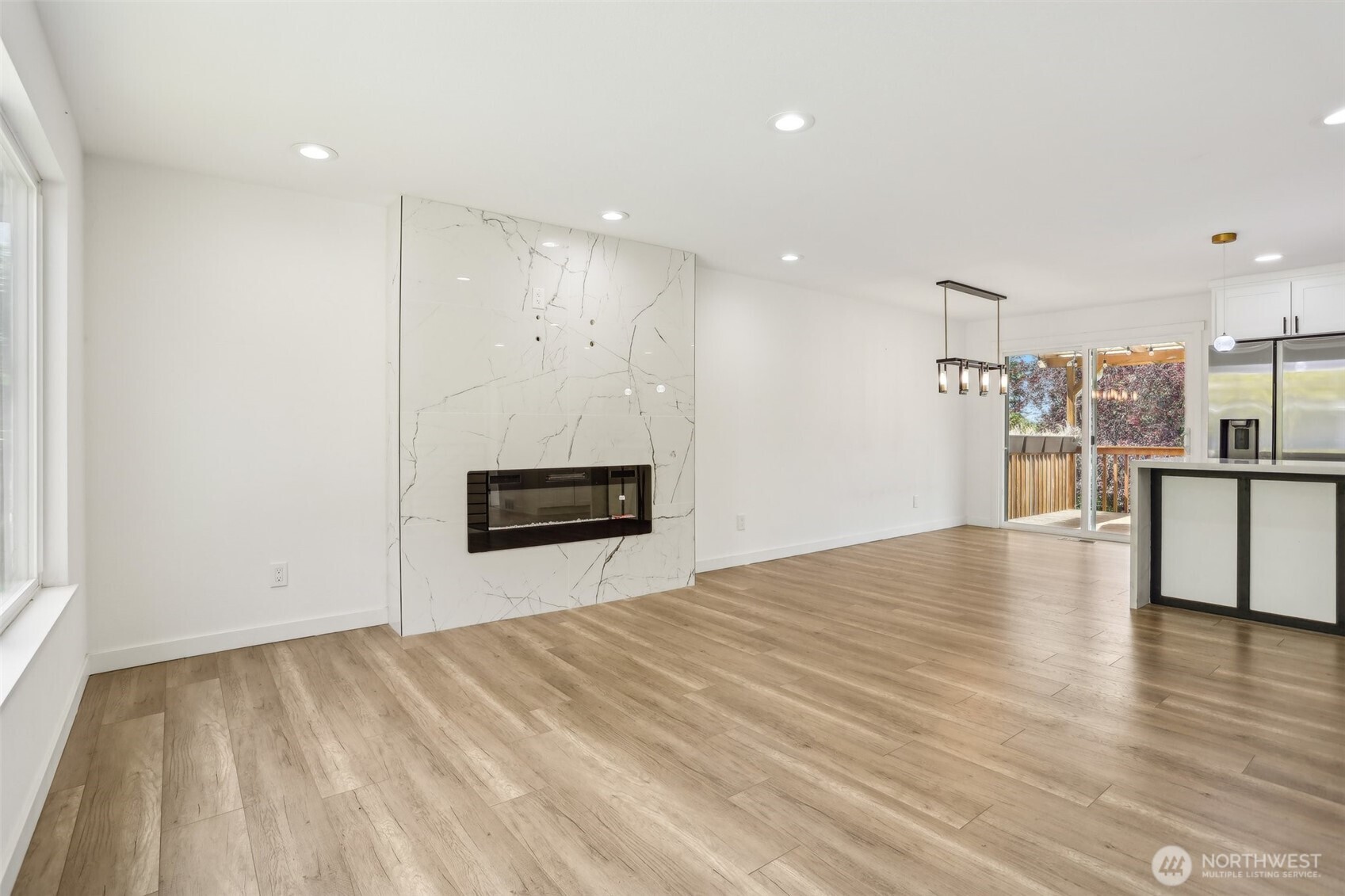 2531 Smithers Avenue South Renton, WA 98055 - Photo 8 of 24 a view of empty room with wooden floor and fireplace