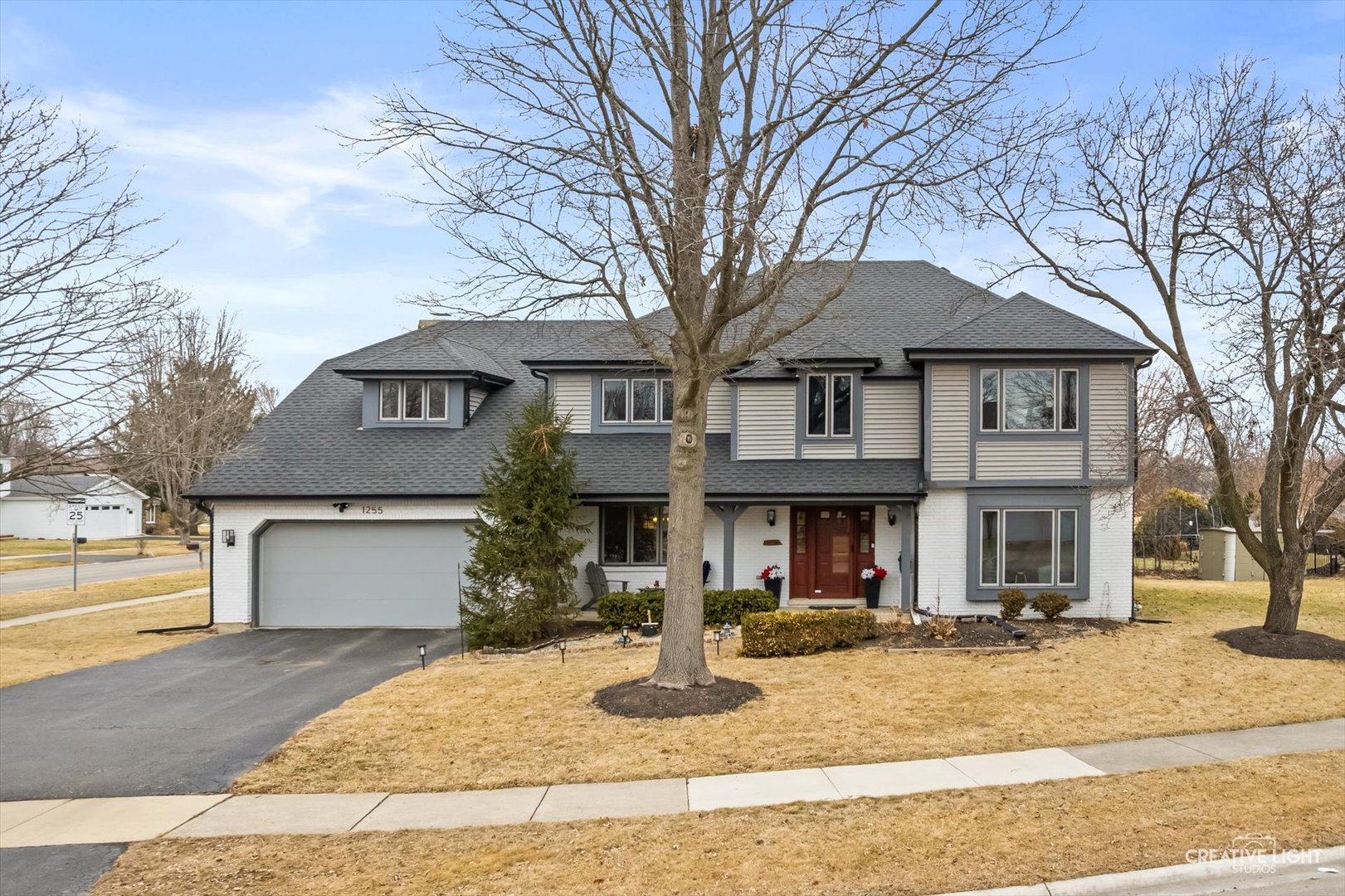 a front view of a house with a yard