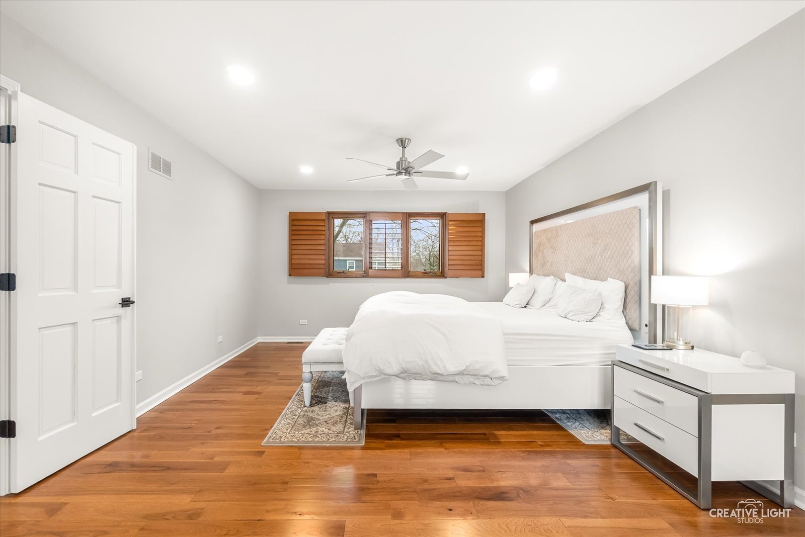 1255 East Bailey Road Naperville, IL 60565 - Photo 13 of 34 a spacious bedroom with a large bed and a window