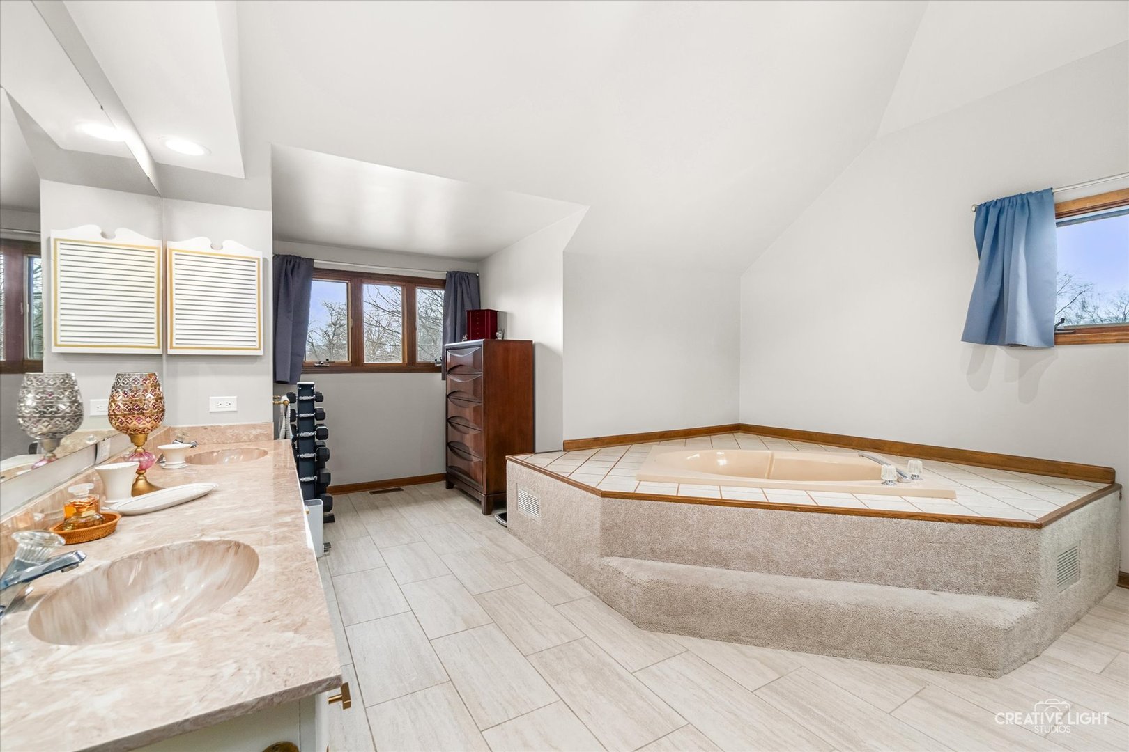 1255 East Bailey Road Naperville, IL 60565 - Photo 15 of 34 a bathroom with a tub sink and mirror