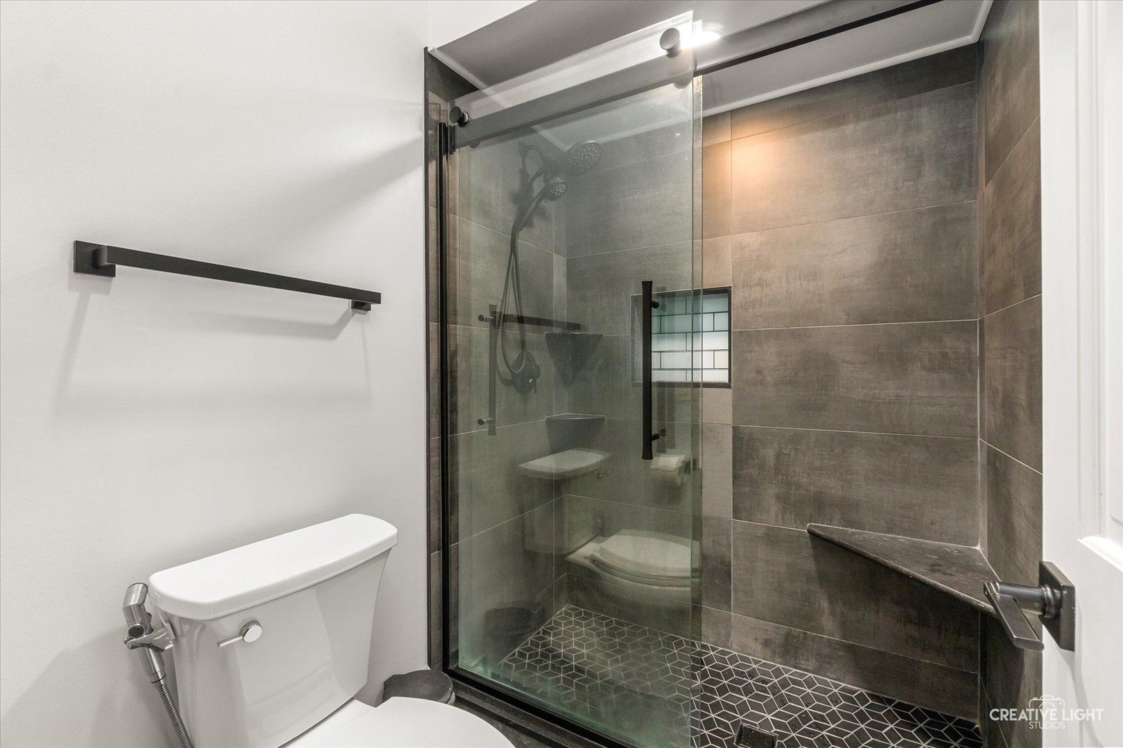 1255 East Bailey Road Naperville, IL 60565 - Photo 16 of 34 a bathroom with a toilet and a shower