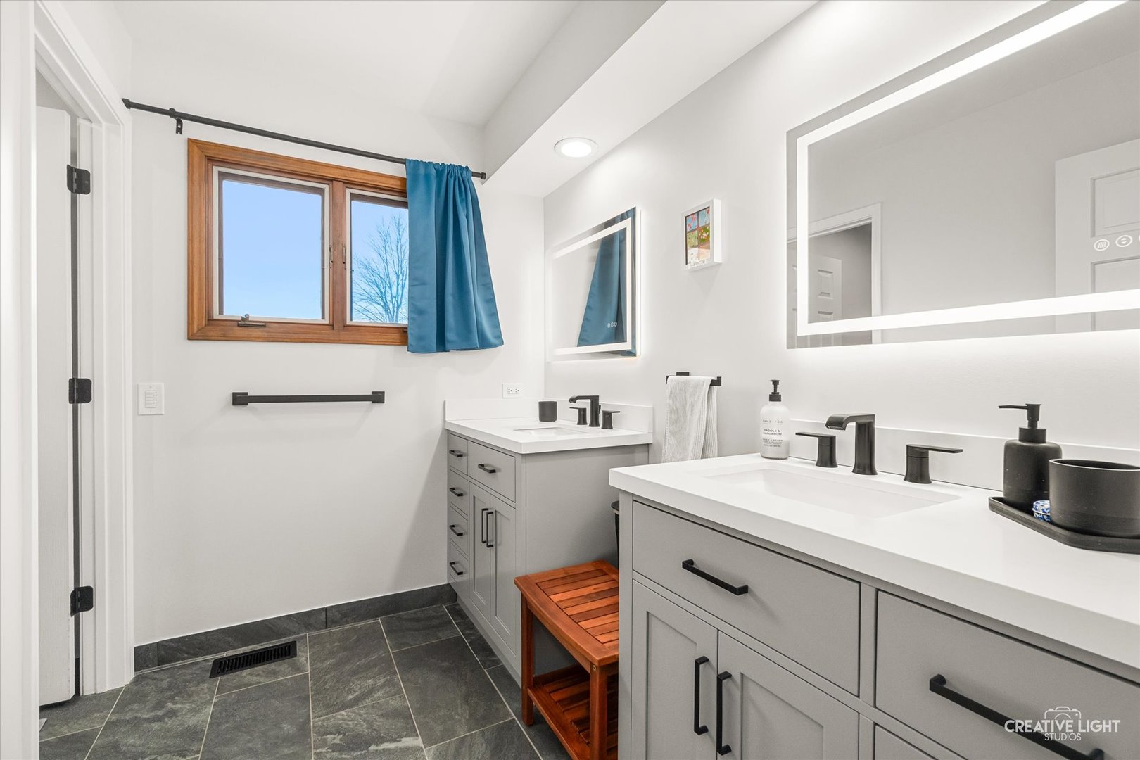 1255 East Bailey Road Naperville, IL 60565 - Photo 18 of 34 a bathroom with a sink vanity and mirror