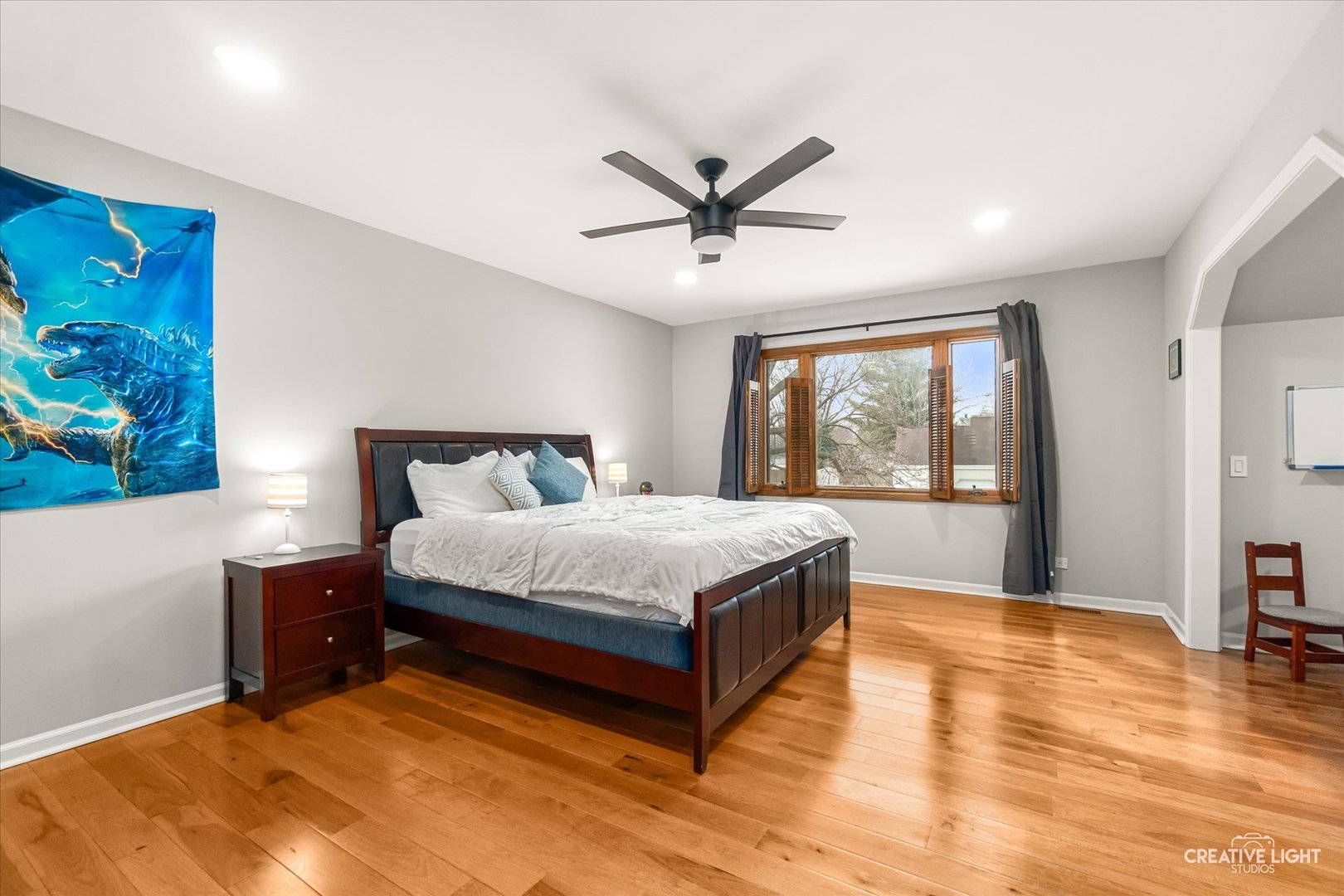 1255 East Bailey Road Naperville, IL 60565 - Photo 20 of 34 a spacious bedroom with a large bed and a chandelier