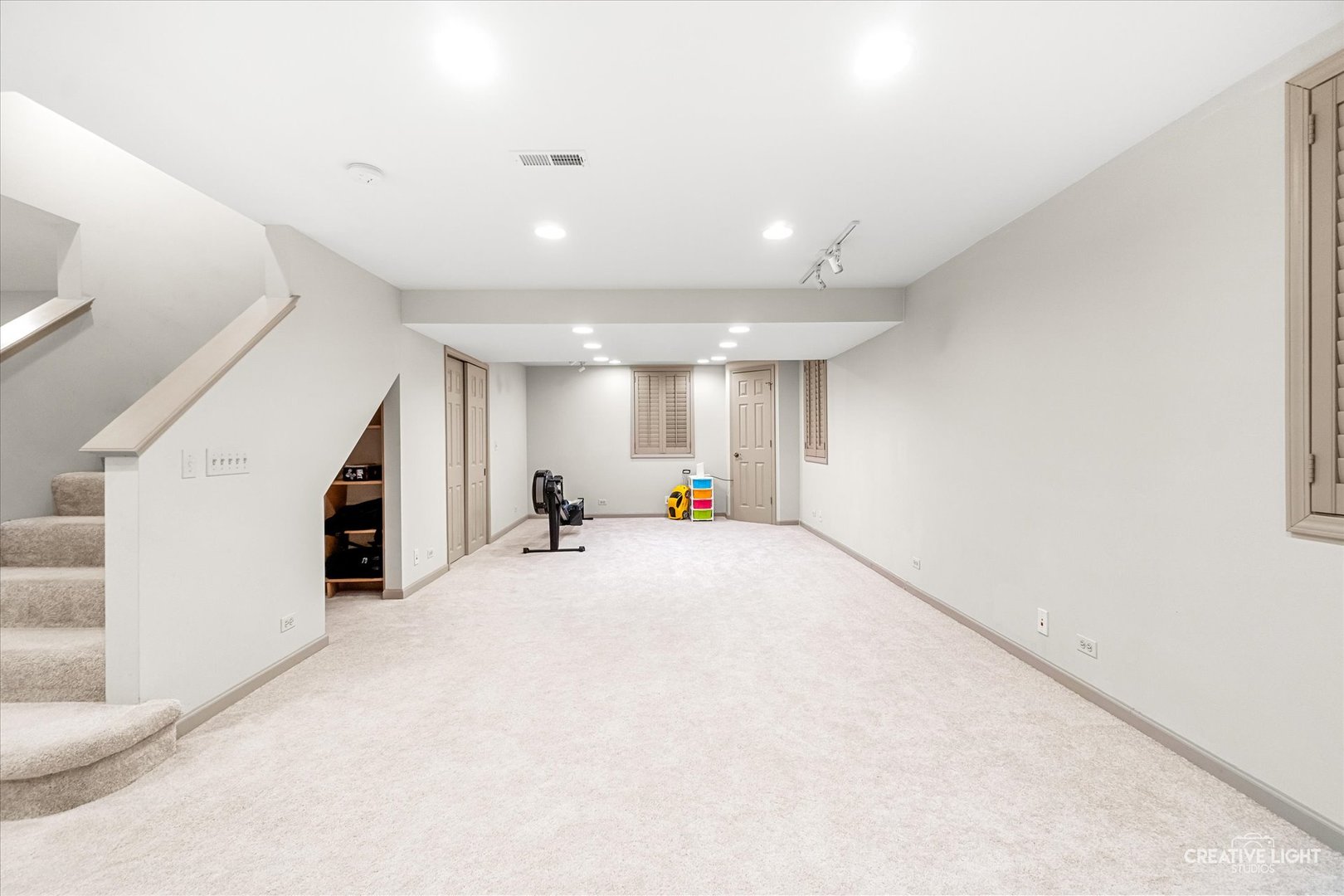 1255 East Bailey Road Naperville, IL 60565 - Photo 22 of 34 a view of empty room with stairs and windows