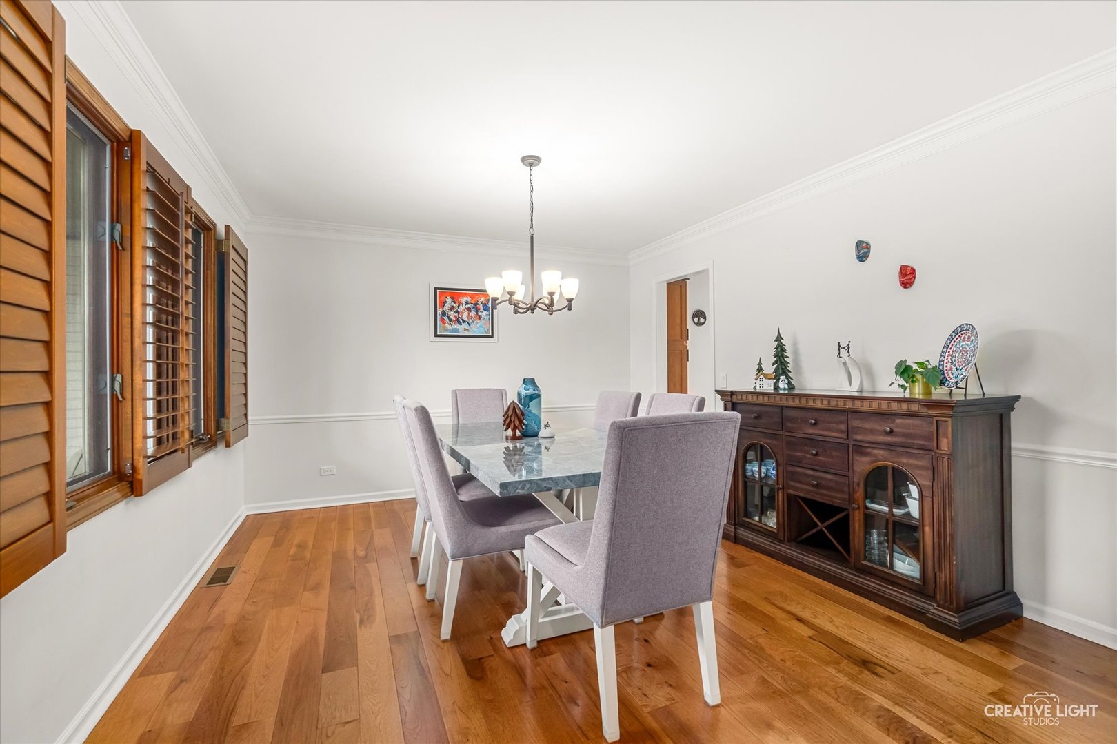 1255 East Bailey Road Naperville, IL 60565 - Photo 3 of 34 a view of a dining room with furniture and wooden floor