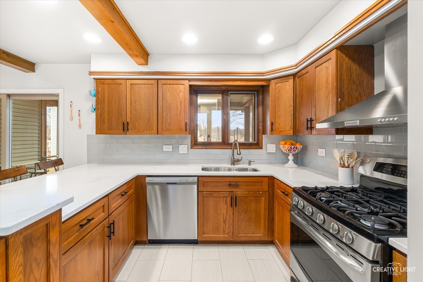 1255 East Bailey Road Naperville, IL 60565 - Photo 6 of 34 a kitchen with a sink stove and cabinets