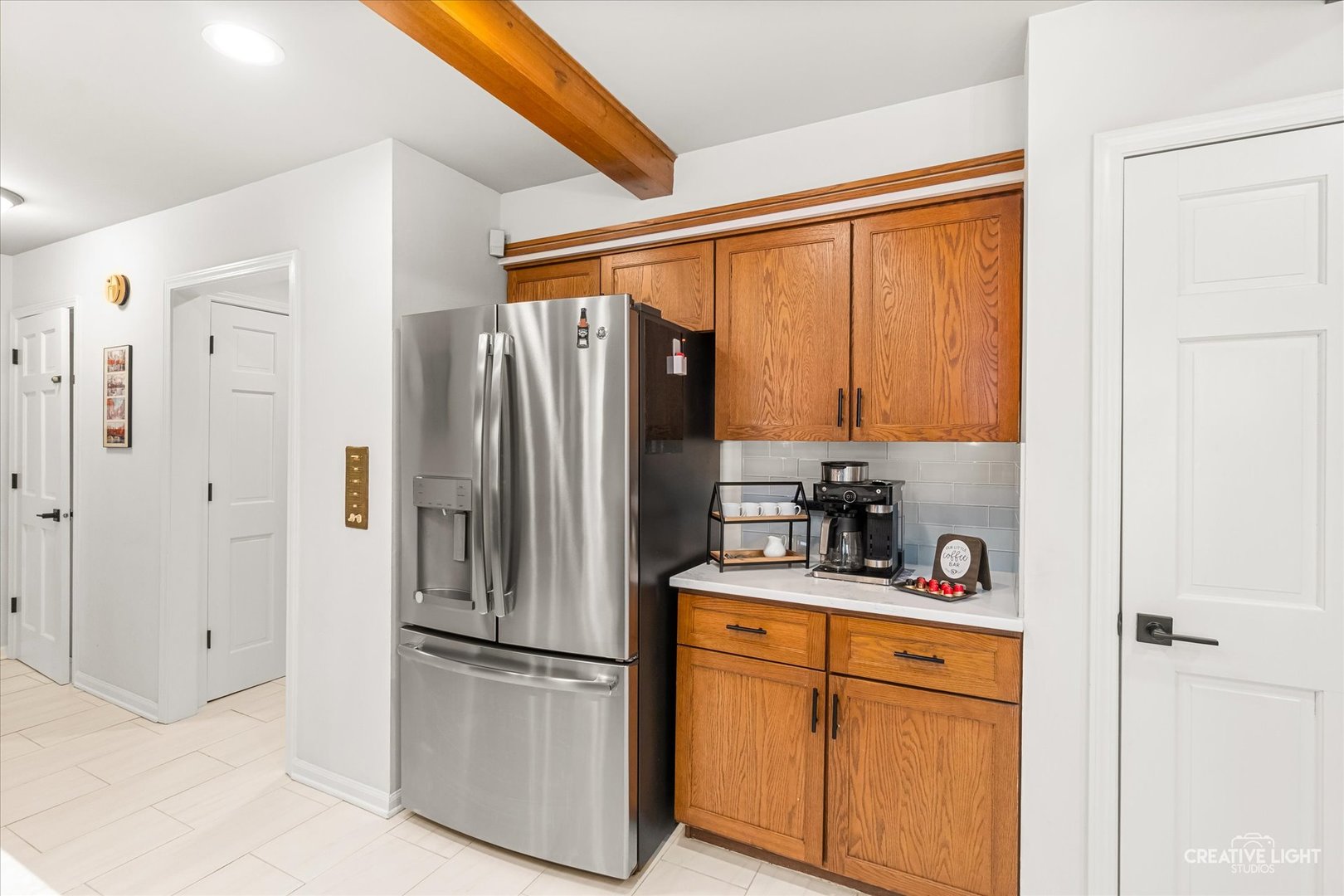 1255 East Bailey Road Naperville, IL 60565 - Photo 8 of 34 a kitchen with stainless steel appliances a refrigerator sink and cabinets