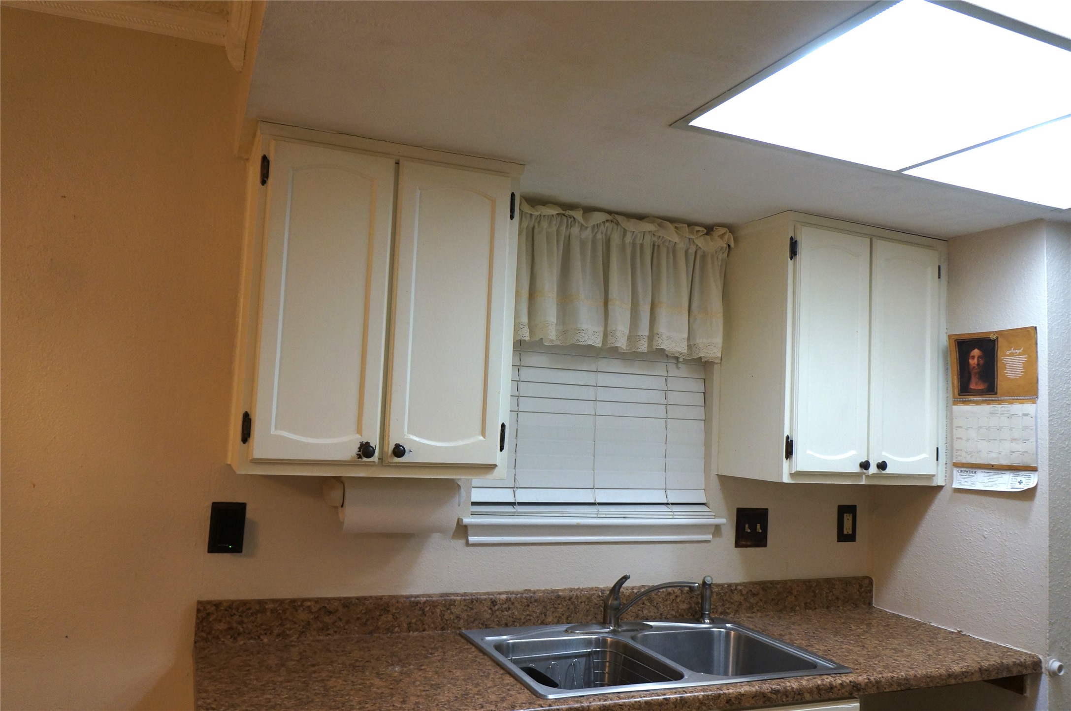 718 Silverpines Road Houston, TX 77062 - Photo 15 of 49 a kitchen with granite countertop a sink and white cabinets