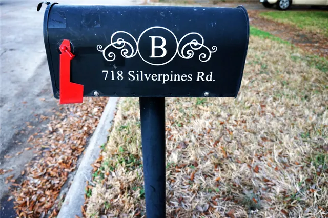 a view of outdoor space with signage and flags