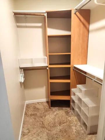 a view of room with an empty shelf