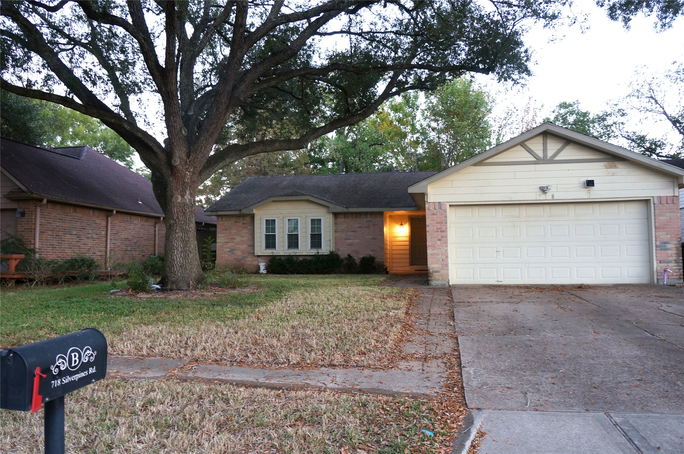 718 Silverpines Road Houston, TX 77062 - Photo 3 of 49 a view of a house with a yard and large tree