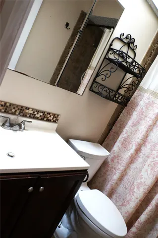 a bathroom with a sink and toilet