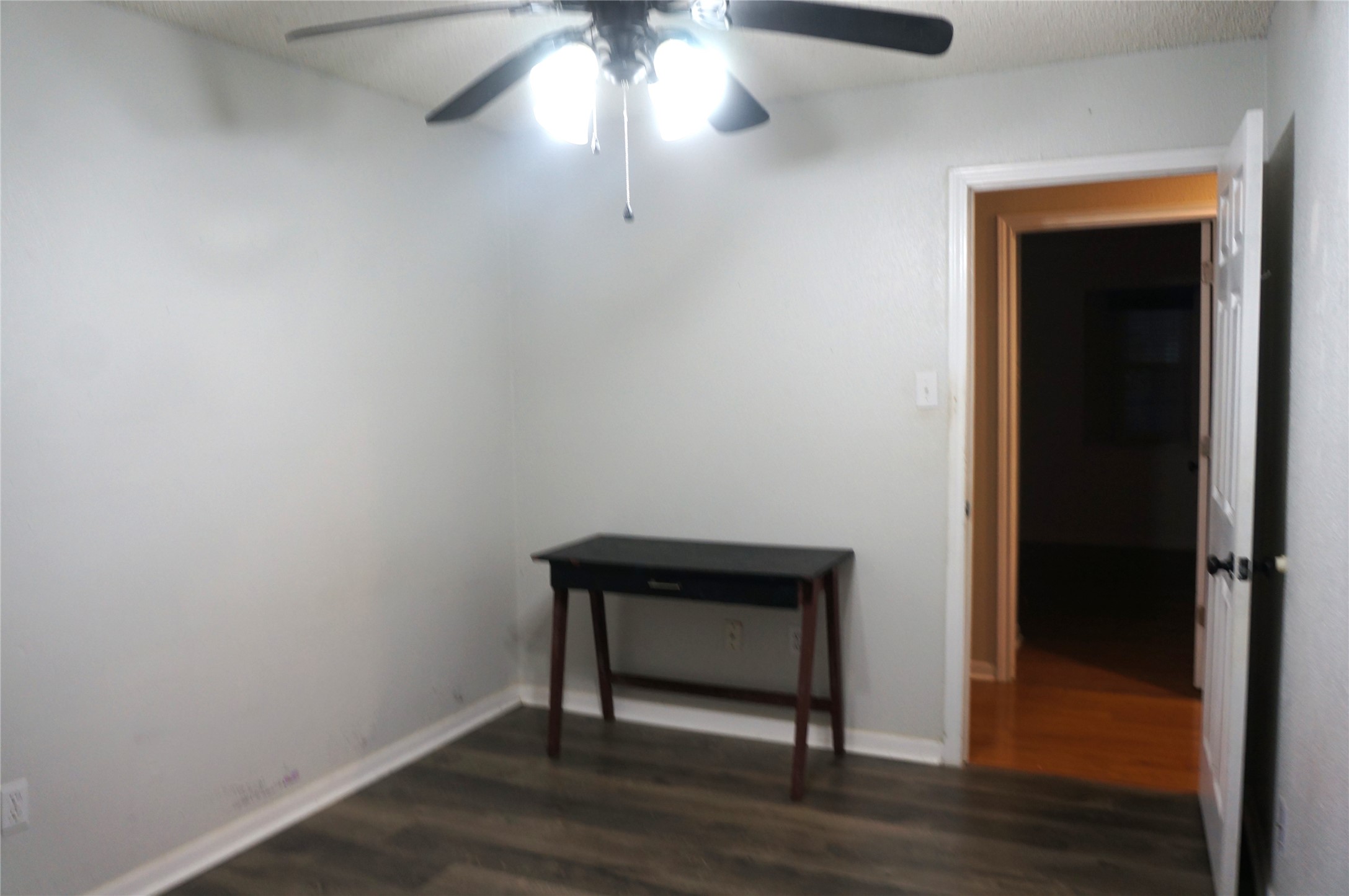 718 Silverpines Road Houston, TX 77062 - Photo 43 of 49 a view of an empty room with wooden floor and a window