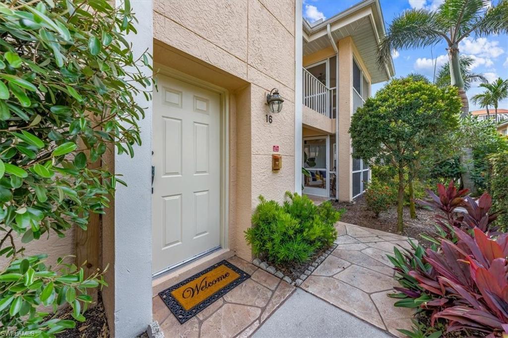 5637 Turtle Bay Drive, Unit 16 Naples, FL 34108 - Photo 1 of 22 a backyard of a house with lots of green space