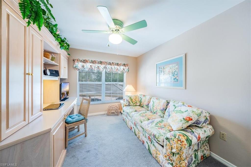 5637 Turtle Bay Drive, Unit 16 Naples, FL 34108 - Photo 11 of 22 a living room with furniture and a large window