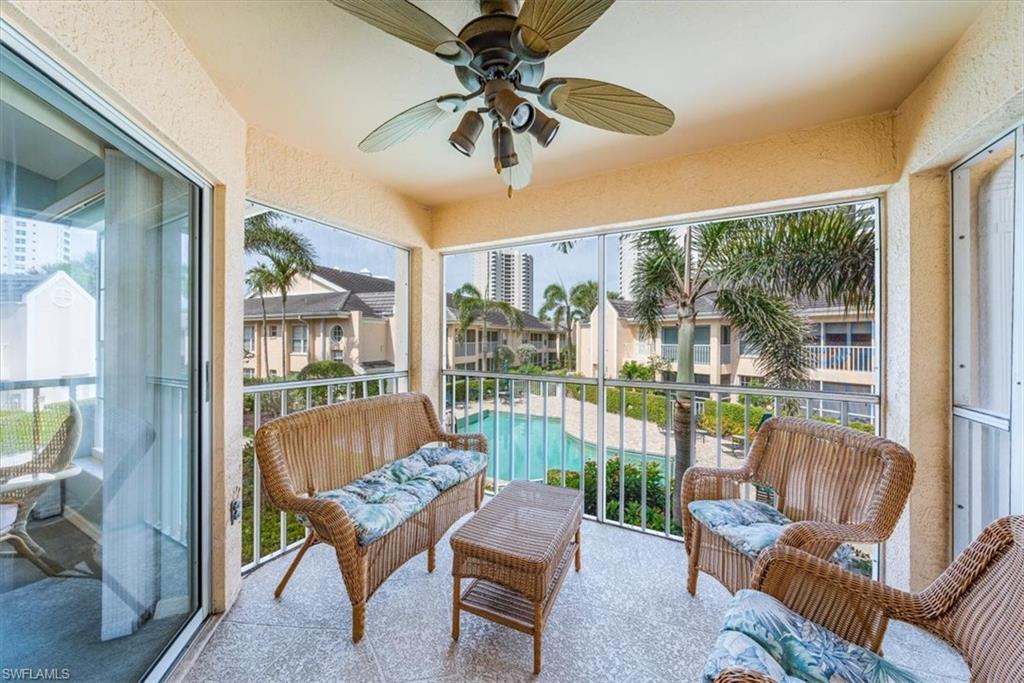 5637 Turtle Bay Drive, Unit 16 Naples, FL 34108 - Photo 19 of 22 a balcony with furniture