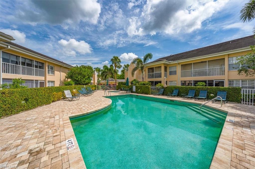 5637 Turtle Bay Drive, Unit 16 Naples, FL 34108 - Photo 22 of 22 a view of a house with a yard porch and sitting area