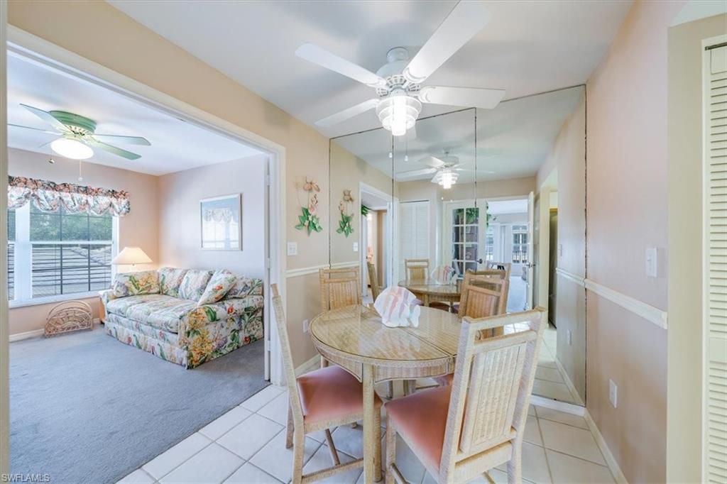 5637 Turtle Bay Drive, Unit 16 Naples, FL 34108 - Photo 9 of 22 a view of a livingroom with furniture and a chandelier fan