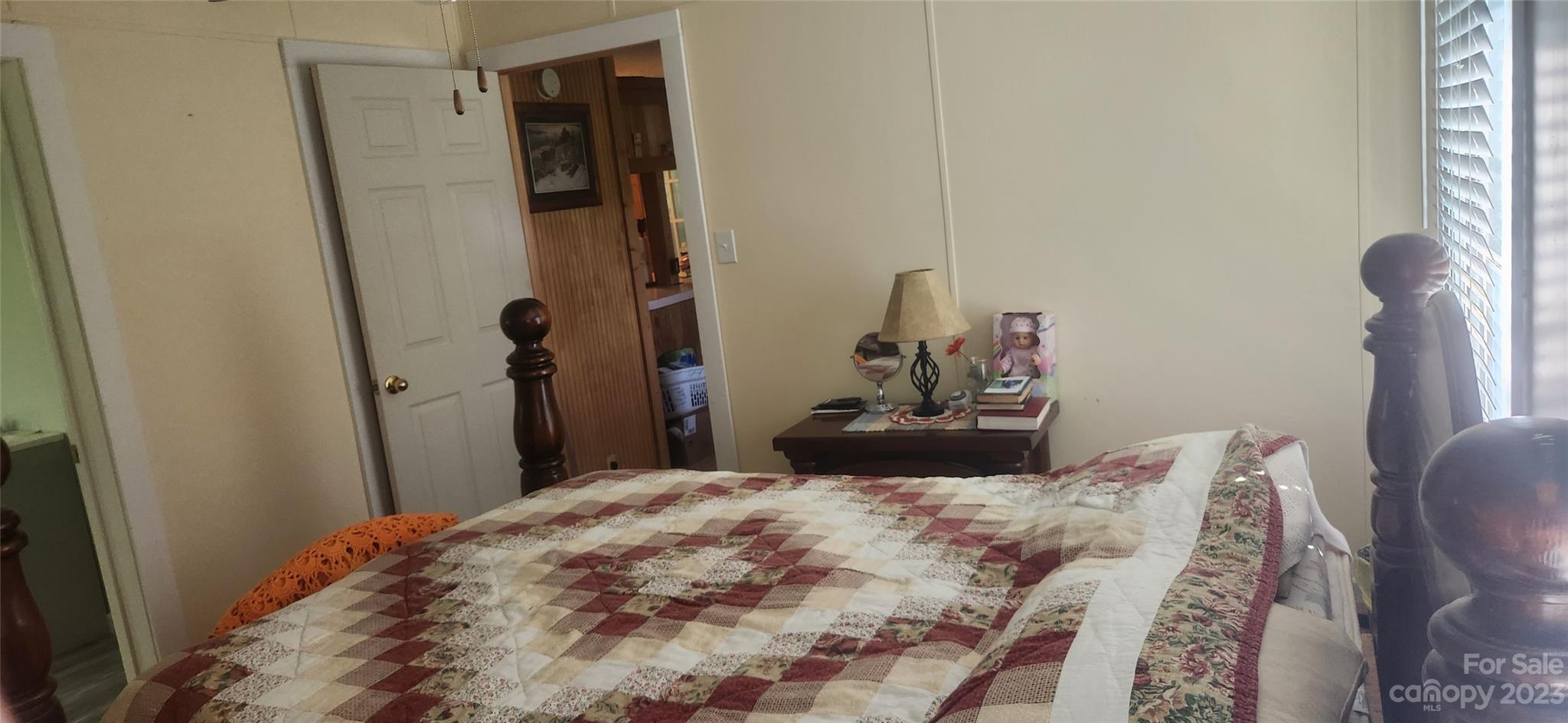 6524 Workman Lane Vale, NC 28168 - Photo 18 of 20 a bedroom with a bed and a mirror