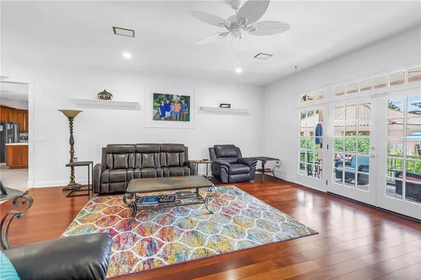 a bedroom with furniture and wooden floor
