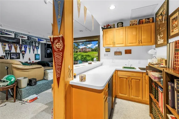 a kitchen that has a sink and a stove