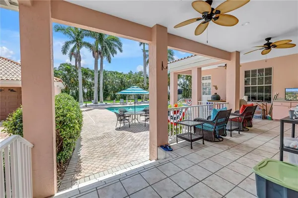 a view of a patio with a dining table and chairs