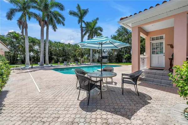 a view of a table and chairs in patio