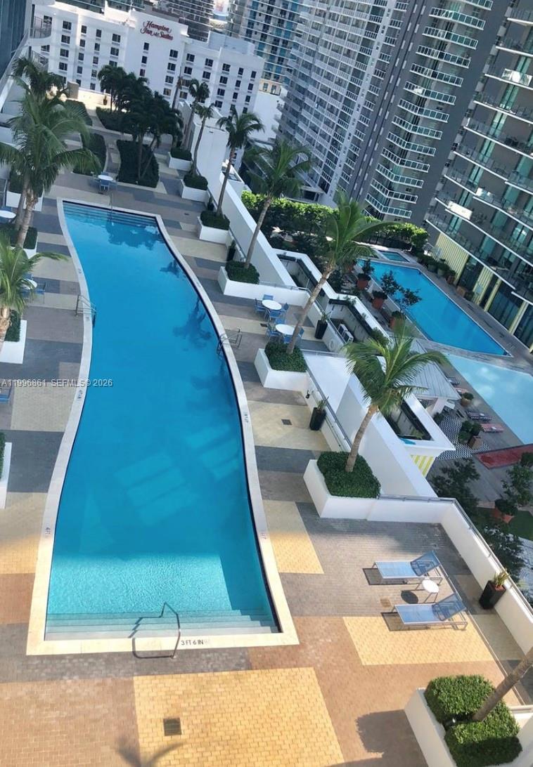 60 Southwest 13th Street, Unit 1611 Miami, FL 33130 - Photo 19 of 28 a picture of a table and chairs