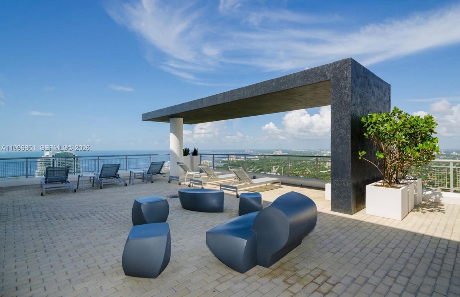 60 Southwest 13th Street, Unit 1611 Miami, FL 33130 - Photo 20 of 28 a outdoor living space with furniture and garden view