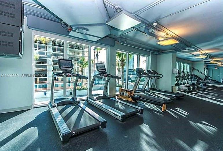 60 Southwest 13th Street, Unit 1611 Miami, FL 33130 - Photo 21 of 28 a view of a room with gym equipment