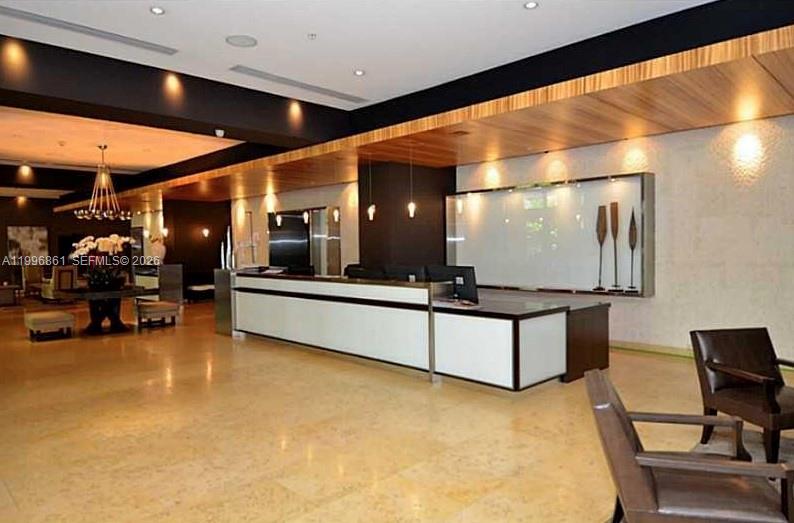 60 Southwest 13th Street, Unit 1611 Miami, FL 33130 - Photo 23 of 28 a lobby with furniture and a large window