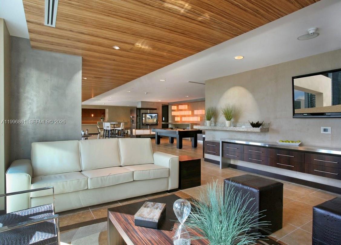60 Southwest 13th Street, Unit 1611 Miami, FL 33130 - Photo 26 of 28 a living room with furniture and kitchen view